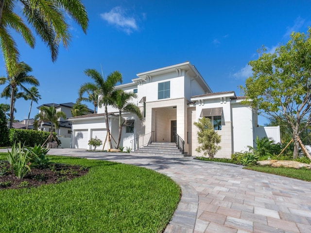 430 Pheasant Way, Sarasota, FL 34236 - view of front of home with stucco siding, driveway, and a front lawn