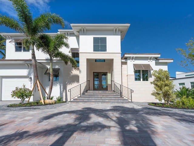 430 Pheasant Way, Sarasota, FL 34236 - view of front of house with french doors, driveway, and stucco siding