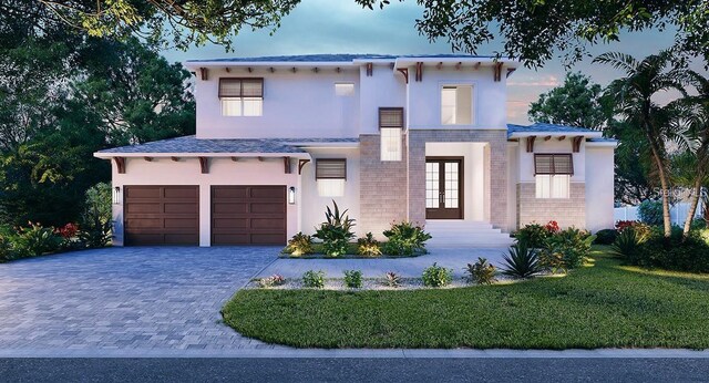 430 Pheasant Way, Sarasota, FL 34236 - view of front facade featuring french doors, stucco siding, an attached garage, decorative driveway, and a front yard