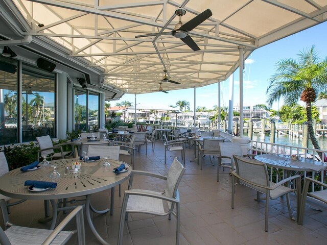 430 Pheasant Way, Sarasota, FL 34236 - view of patio / terrace with outdoor dining area and a water view