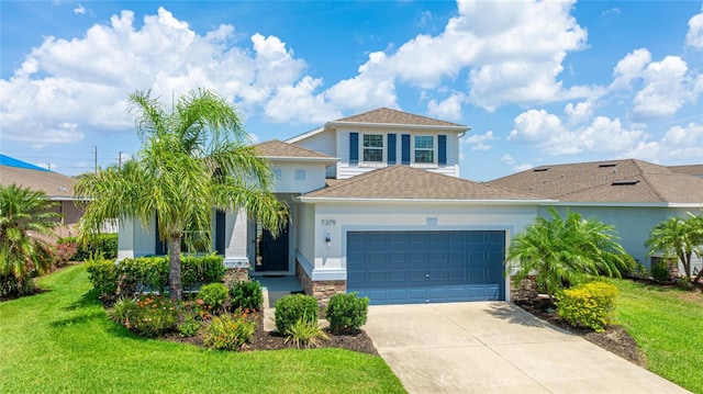 7379 47th Avenue Cir E, Bradenton, FL 34203 - view of front of property featuring an attached garage, a front yard, concrete driveway, and a shingled roof