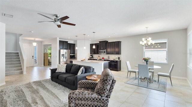 7379 47th Avenue Cir E, Bradenton, FL 34203 - living room featuring light tile patterned flooring, healthy amount of natural light, a chandelier, and recessed lighting