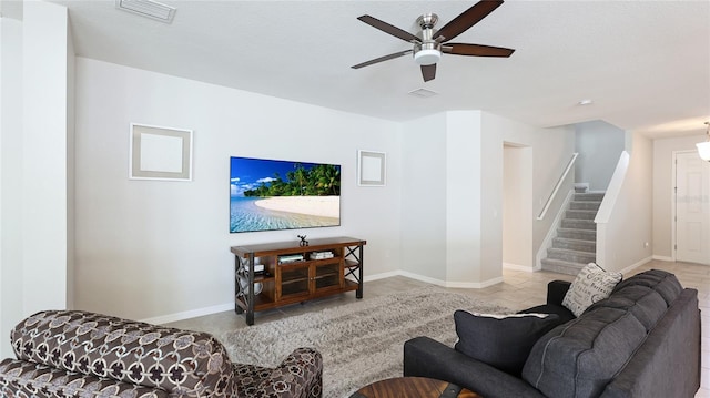 7379 47th Avenue Cir E, Bradenton, FL 34203 - living room featuring stairway, ceiling fan, and baseboards