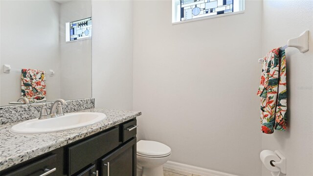 7379 47th Avenue Cir E, Bradenton, FL 34203 - bathroom featuring healthy amount of natural light, toilet, and vanity
