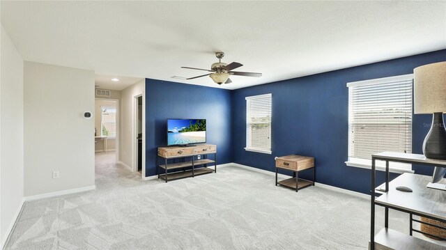 7379 47th Avenue Cir E, Bradenton, FL 34203 - carpeted living room featuring a ceiling fan and baseboards
