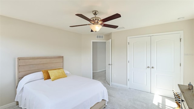 7379 47th Avenue Cir E, Bradenton, FL 34203 - bedroom featuring light carpet, a closet, baseboards, and a ceiling fan