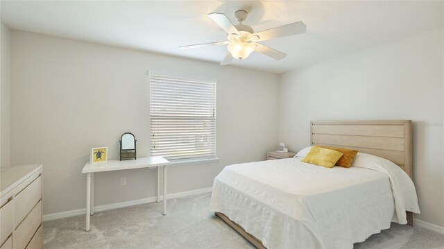7379 47th Avenue Cir E, Bradenton, FL 34203 - bedroom with light colored carpet, baseboards, and a ceiling fan