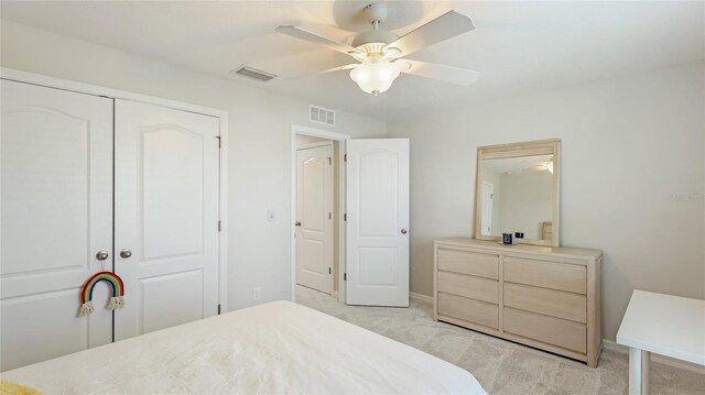 7379 47th Avenue Cir E, Bradenton, FL 34203 - bedroom featuring light colored carpet, a closet, ceiling fan, and baseboards