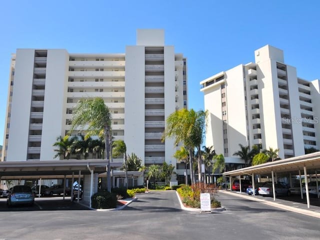 19 Whispering Sands Dr Unit 805, Sarasota, FL 34242 - view of building exterior featuring covered parking
