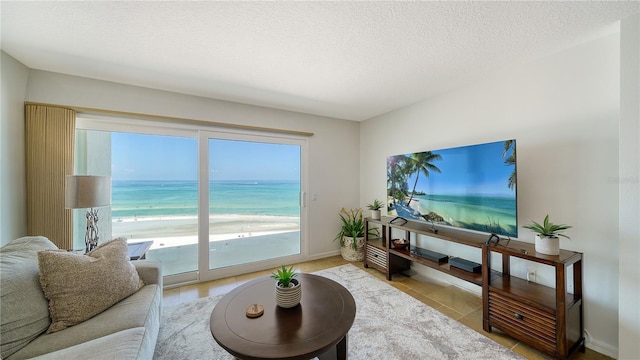 19 Whispering Sands Dr Unit 805, Sarasota, FL 34242 - living room with a textured ceiling and baseboards