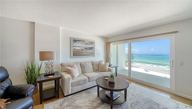 19 Whispering Sands Dr Unit 805, Sarasota, FL 34242 - living room with a textured ceiling and light tile patterned floors