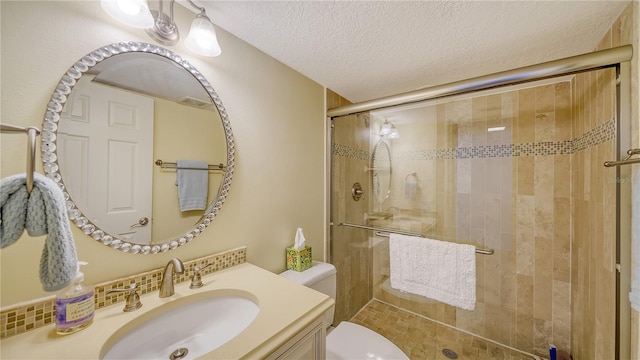 19 Whispering Sands Dr Unit 805, Sarasota, FL 34242 - full bath featuring toilet, a stall shower, vanity, and a textured ceiling