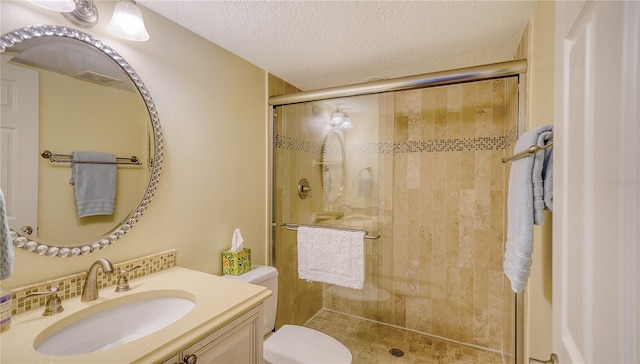 19 Whispering Sands Dr Unit 805, Sarasota, FL 34242 - full bathroom with toilet, a shower stall, vanity, and a textured ceiling