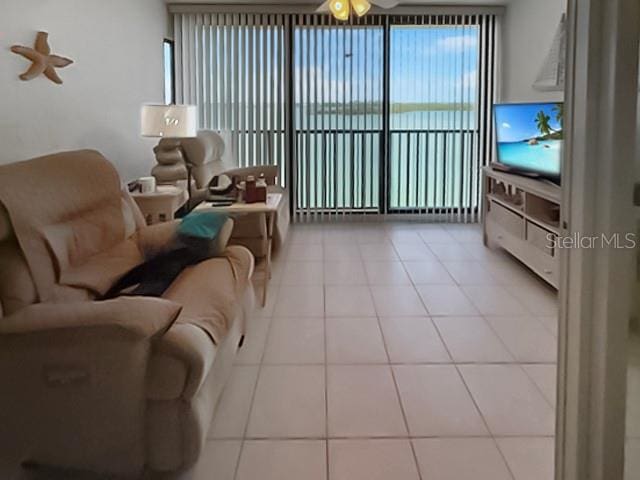 8977 Midnight Pass Rd Unit 521, Sarasota, FL 34242 - tiled living area with ceiling fan