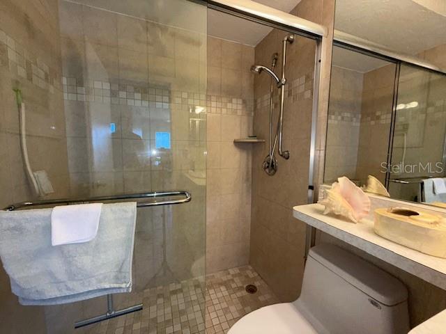 8977 Midnight Pass Rd Unit 521, Sarasota, FL 34242 - full bath featuring toilet and a shower stall