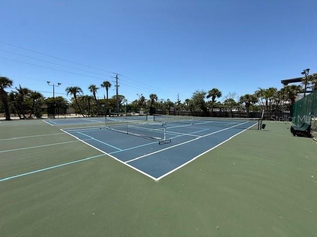 8977 Midnight Pass Rd Unit 521, Sarasota, FL 34242 - view of tennis court featuring community basketball court