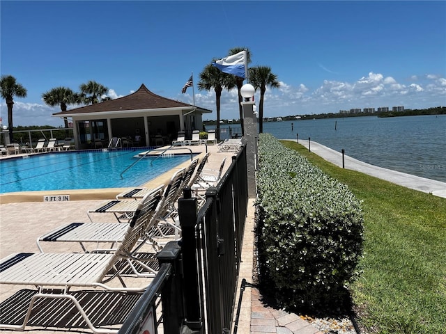 8977 Midnight Pass Rd Unit 521, Sarasota, FL 34242 - community pool featuring a patio area and a water view