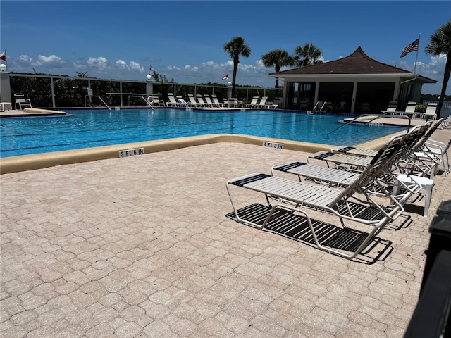 8977 Midnight Pass Rd Unit 521, Sarasota, FL 34242 - community pool featuring a patio area