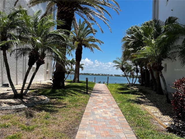 8977 Midnight Pass Rd Unit 521, Sarasota, FL 34242 - view of home's community featuring a water view and a lawn