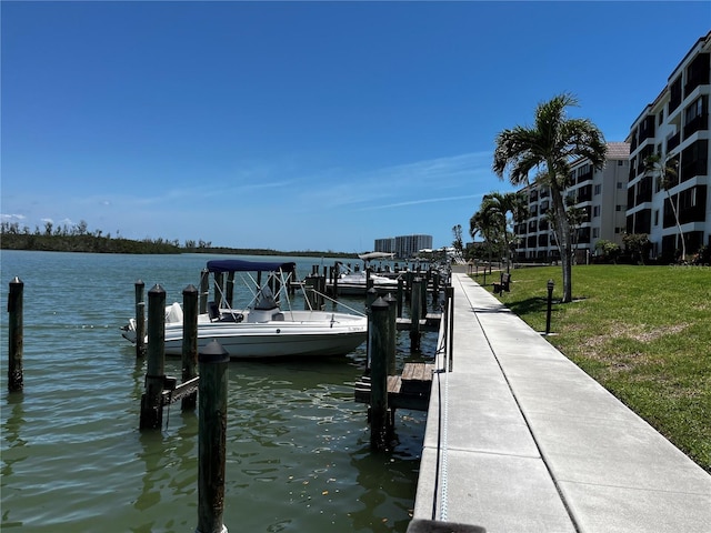 8977 Midnight Pass Rd Unit 521, Sarasota, FL 34242 - dock with a water view and a lawn