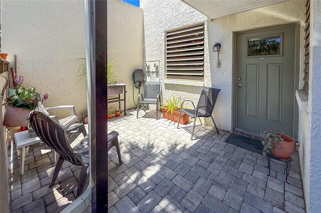 157 Pinehurst Dr Unit 157, Bradenton, FL 34210 - property entrance with stucco siding and a patio area