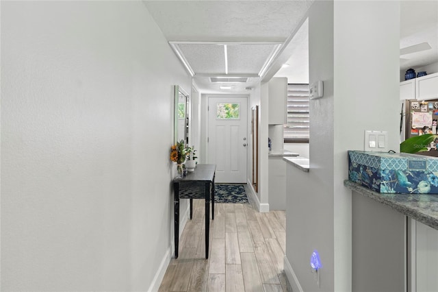 157 Pinehurst Dr Unit 157, Bradenton, FL 34210 - foyer entrance featuring light wood-style floors and baseboards