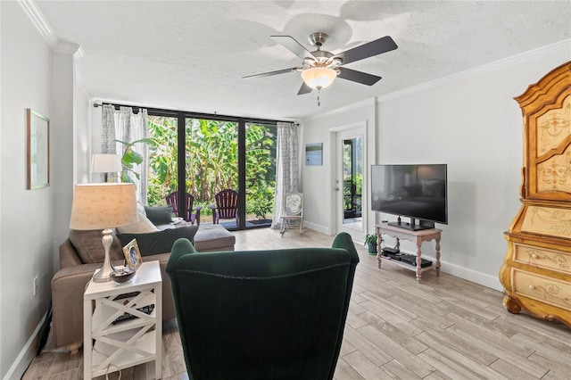 157 Pinehurst Dr Unit 157, Bradenton, FL 34210 - living area featuring ornamental molding, baseboards, light wood finished floors, ceiling fan, and a textured ceiling