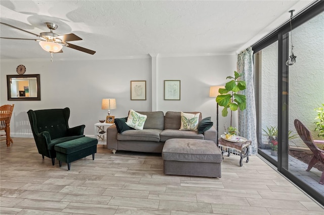 157 Pinehurst Dr Unit 157, Bradenton, FL 34210 - living room featuring ornamental molding, light wood-style floors, and ceiling fan