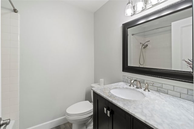 157 Pinehurst Dr Unit 157, Bradenton, FL 34210 - bathroom featuring toilet, vanity, wood finished floors, shower / bathtub combination, and baseboards