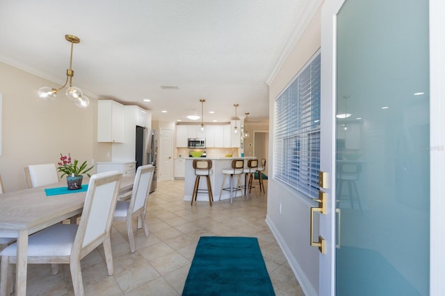 dining room with crown molding, light tile patterned floors, baseboards, and recessed lighting