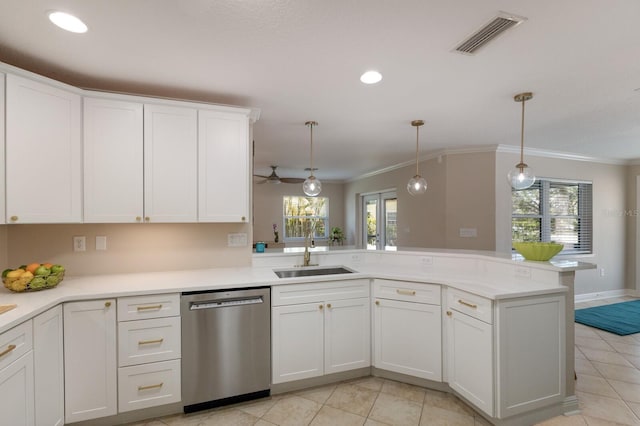 kitchen featuring dishwasher, a sink, ornamental molding, light tile patterned floors, and light countertops