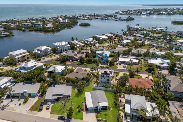 aerial view of residential area with a nearby body of water