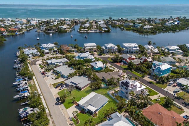 aerial perspective of suburban area featuring a large body of water