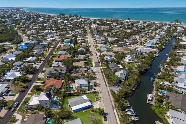 aerial overview of property's location featuring a nearby body of water and nearby suburban area