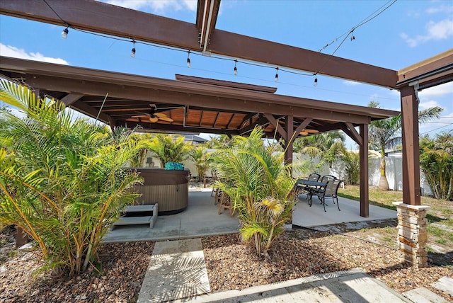 9089 Berendo Ave, Englewood, FL 34224 - view of patio with a hot tub, a ceiling fan, and a gazebo
