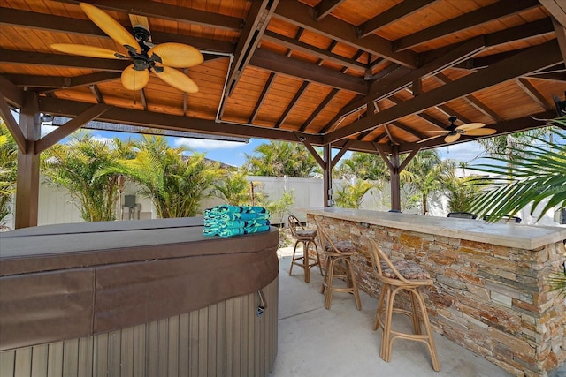 9089 Berendo Ave, Englewood, FL 34224 - fenced backyard featuring a ceiling fan, a hot tub, and a gazebo