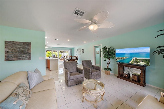 9089 Berendo Ave, Englewood, FL 34224 - living room featuring a ceiling fan, light tile patterned floors, and baseboards