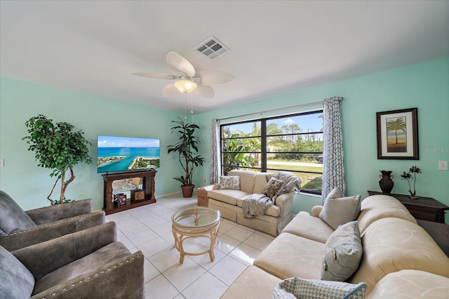 9089 Berendo Ave, Englewood, FL 34224 - living area with light tile patterned flooring and a ceiling fan