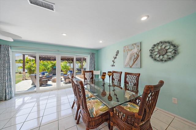9089 Berendo Ave, Englewood, FL 34224 - dining space featuring french doors, light tile patterned floors, recessed lighting, and baseboards