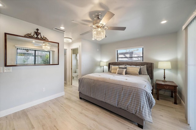9089 Berendo Ave, Englewood, FL 34224 - bedroom with baseboards, recessed lighting, wood finished floors, ensuite bath, and ceiling fan