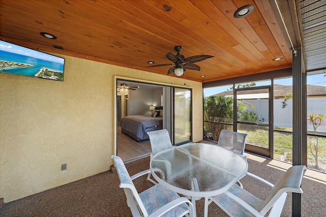 9089 Berendo Ave, Englewood, FL 34224 - sunroom with a ceiling fan and outdoor dining area