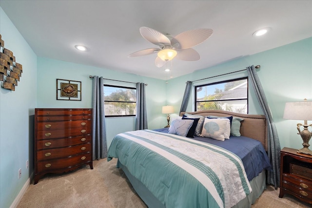 9089 Berendo Ave, Englewood, FL 34224 - bedroom featuring light carpet, ceiling fan, and recessed lighting