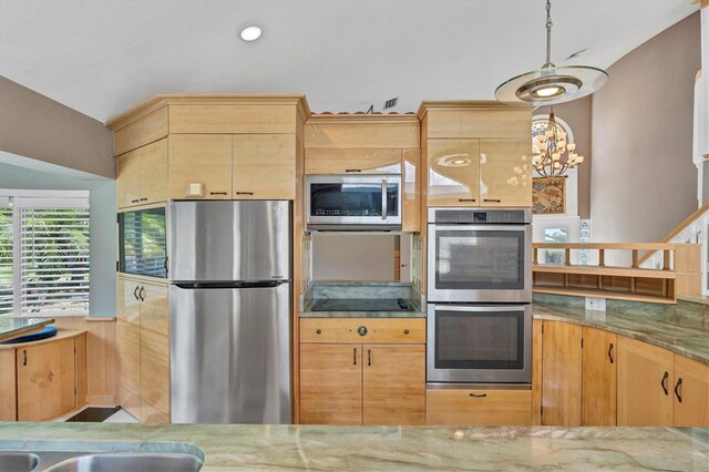 919 Palm View Way, Sarasota, FL 34240 - kitchen featuring stainless steel appliances, light brown cabinets, stone countertops, and a chandelier