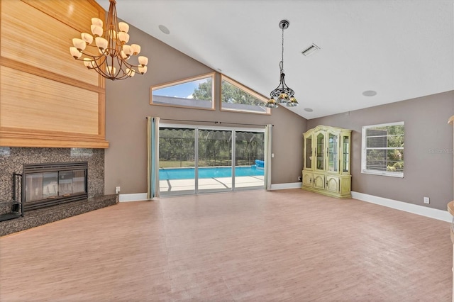 919 Palm View Way, Sarasota, FL 34240 - unfurnished living room with a chandelier, high vaulted ceiling, wood finished floors, baseboards, and a high end fireplace
