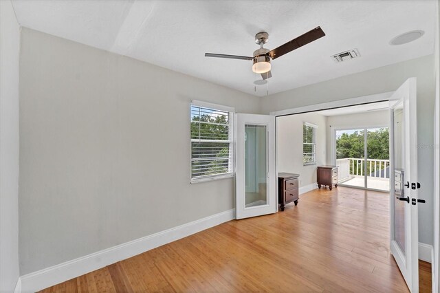 919 Palm View Way, Sarasota, FL 34240 - spare room with french doors, baseboards, and light wood-style floors