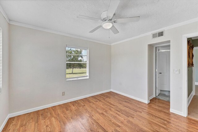 919 Palm View Way, Sarasota, FL 34240 - unfurnished room featuring light wood finished floors, crown molding, baseboards, a textured ceiling, and ceiling fan