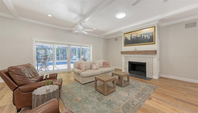 4665 Pine Harrier Dr, Sarasota, FL 34231 - living area with a ceiling fan, ornamental molding, wood finished floors, recessed lighting, and a premium fireplace