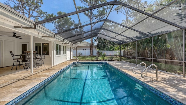 4665 Pine Harrier Dr, Sarasota, FL 34231 - view of swimming pool featuring a fenced backyard, a patio, and glass enclosure