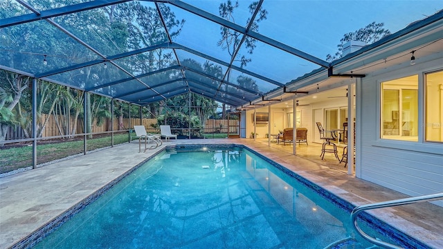 4665 Pine Harrier Dr, Sarasota, FL 34231 - view of swimming pool featuring a patio area, a fenced backyard, and glass enclosure