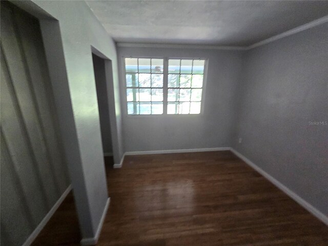 2905 Sunset Rd, Melbourne, FL 32904 - empty room with dark wood finished floors and baseboards